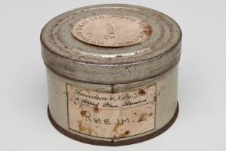 Circular Storage Tin Labelled RHEUM.