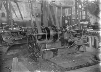 Machine Shop With Lathes and Shell Casings 