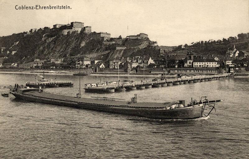 Coblenz - Boat on river with town in the background