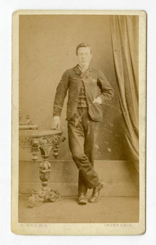 Dapper young man standing