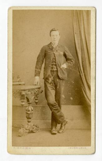 Dapper young man standing