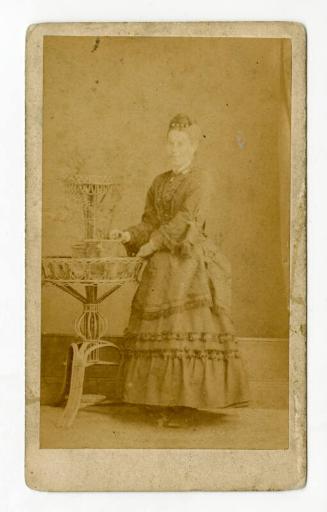 Standing young woman with hair ornament