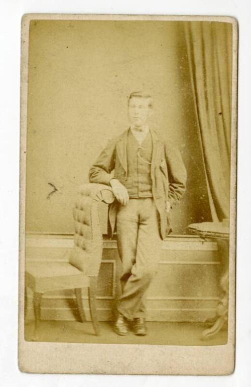 Supercilious young man, standing