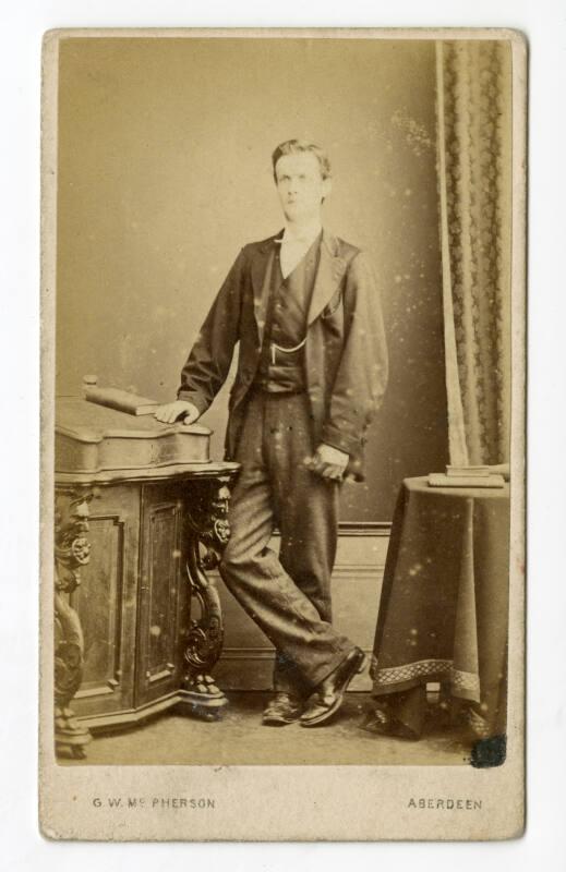 Standing young man with gloves