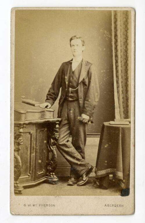 Standing young man with gloves