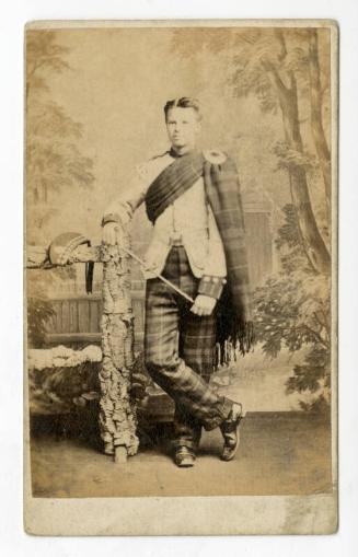 Standing young man in Highland regimental dress uniform