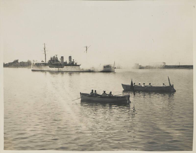 30b. HMS Delphinium fires a Royal Salute on arrival of Carnarvon Castle at Lobito