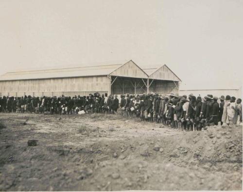78. Native Railway Workers queue for [rations]
