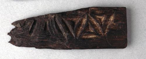 Fragment of carved wood from casket or furniture