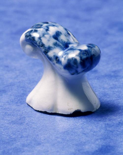 The knob of a ceramic vessel