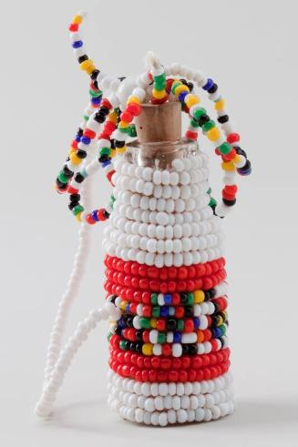 Minature bottle covered with beads