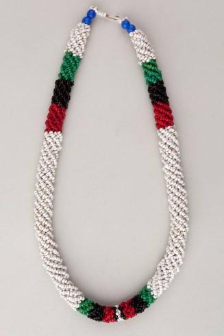 White, red, black and green bead necklace
