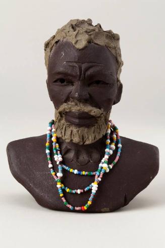 Xulu head wearing bead necklace
