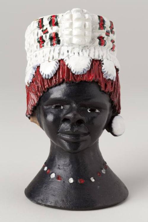 Carved female zulu head with painted head dress