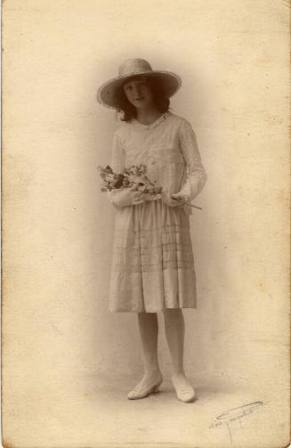 Portrait Postcard: Young girl holding flower 