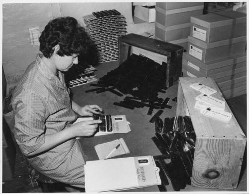 Aberdeen Comb Works Employee at Work, Mounting Combs on Card