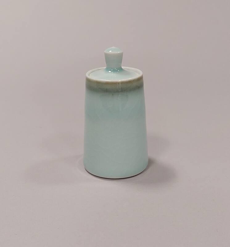 Porcelain Small Lidded Jar with Celadon and Tenmoku Glaze