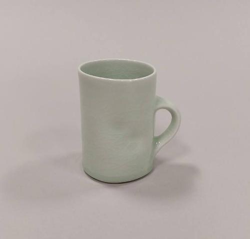 Porcelain Mug with Squashed Sides and Celadon Glaze