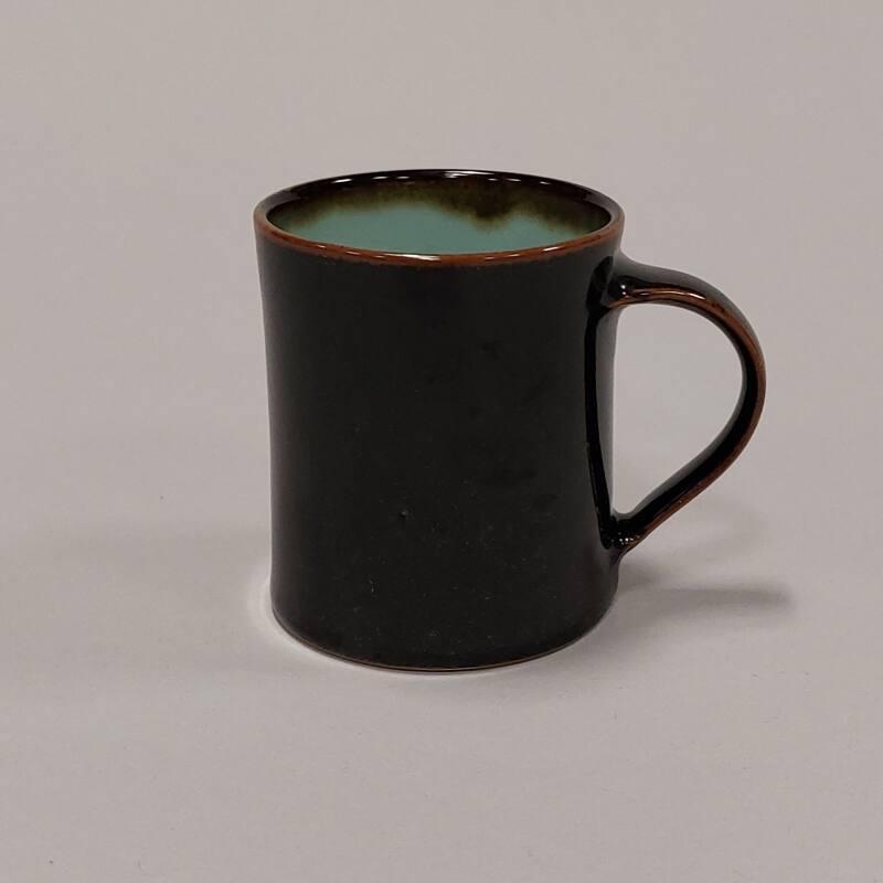 Porcelain Mug with Tenmoku and Celadon Glazes