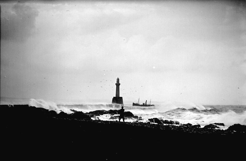 Trawler Entering Harbour at South Breakwater Pier, Storm