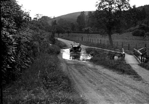 Car Going Through Water Splashes