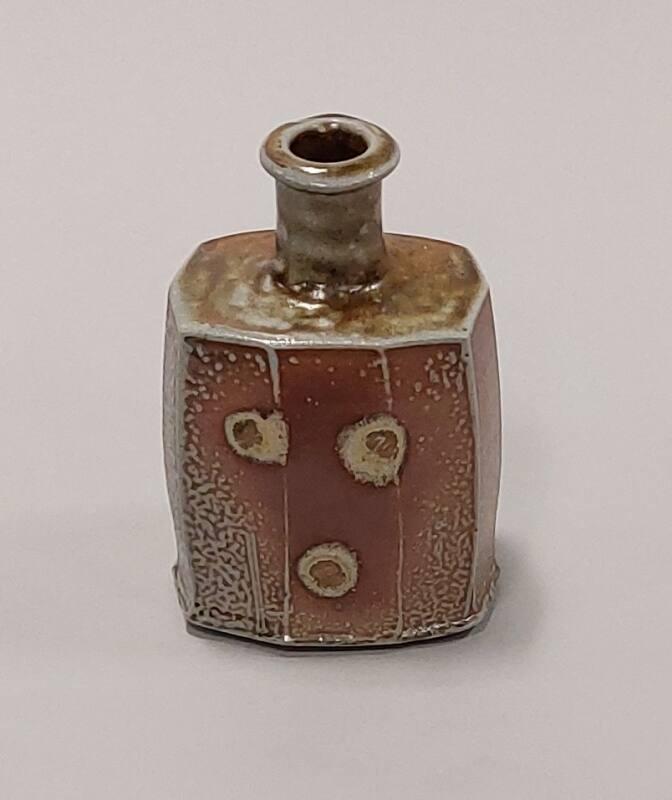 Salt Glaze Faceted Press Moulded Bottle with Iron Ash Glaze And Shell Marks