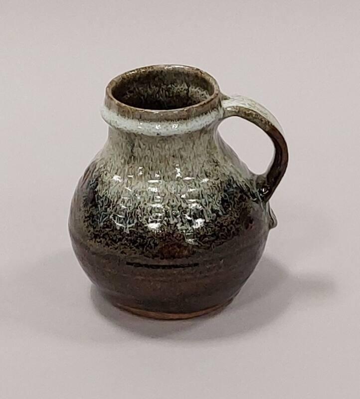 Stoneware Lipless Jug With Tenmoku Glaze Over Iron Mottled Glazes With Chun White Glaze