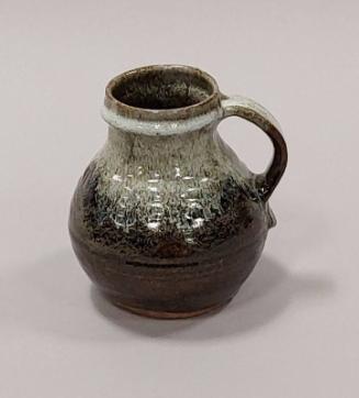 Stoneware Lipless Jug With Tenmoku Glaze Over Iron Mottled Glazes With A Chun White Glaze