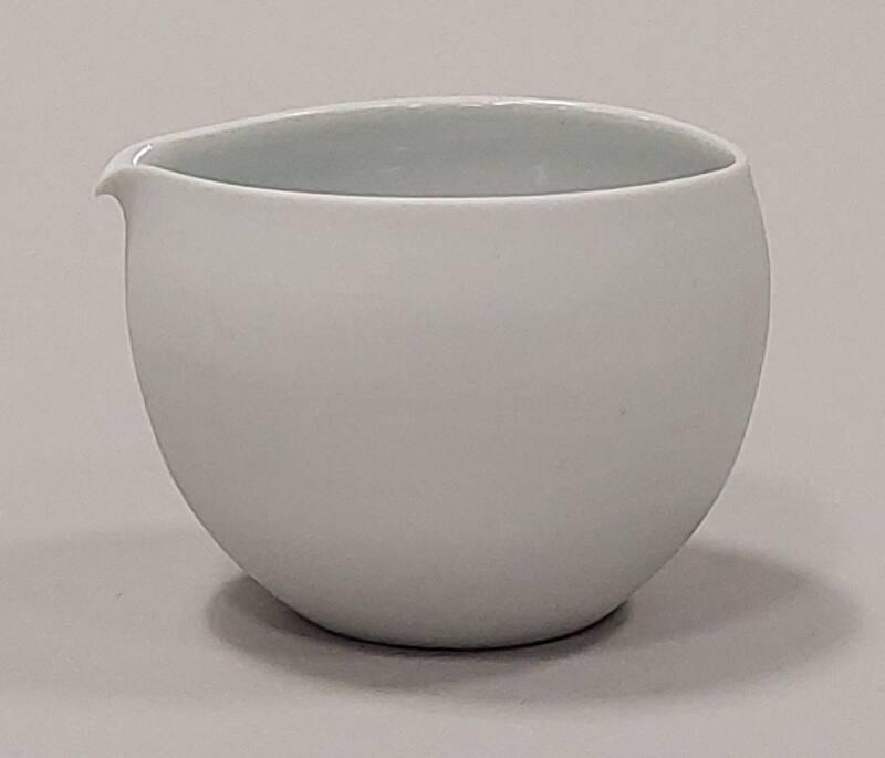 Small Porcelain Pourer With Unglazed Exterior And Celadon Interior