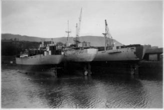 Black and White Photograph in album of three ships fitting out at Burntisland Shipyard