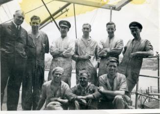 Photograph of engineers aboard ship