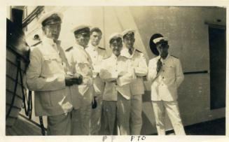 Photograph of group of officers aboard unknown vessel (mr jackson, david law, mr moncrieff, mr wilkie, 8th engineer and mr smithson)
