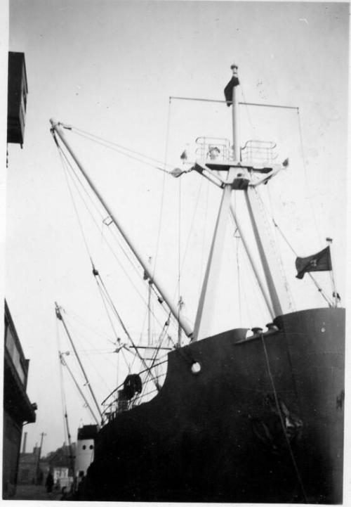 Black and White Photograph in album of cargo vessel 'Falster' rigging and bow