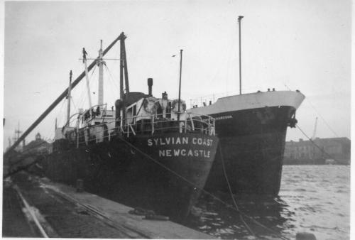 Black and White Photograph in album of cargo vessel 'Sylvian Coast' in Aberdeen harbour