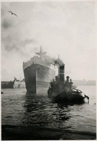 Black and White Photograph in album of ship 'Margaret Clunies' under tow