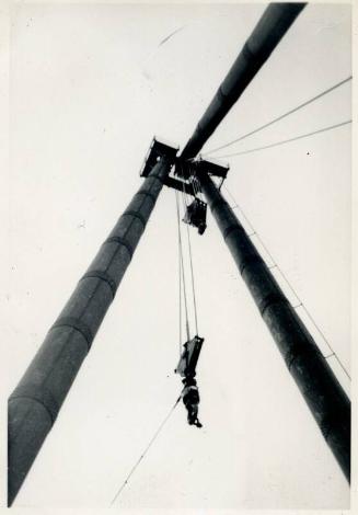 Black and White Photograph in album of ship's lifting tackle