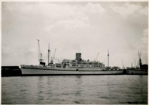 Black and White Photograph in album of docked passenger vessel