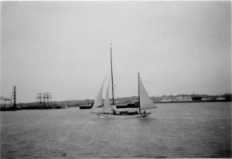 Black and White Photograph in album of yacht under way