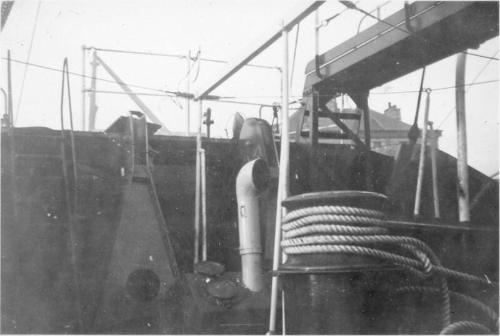 Black and White Photograph in album onboard ship - close up of deck fittings