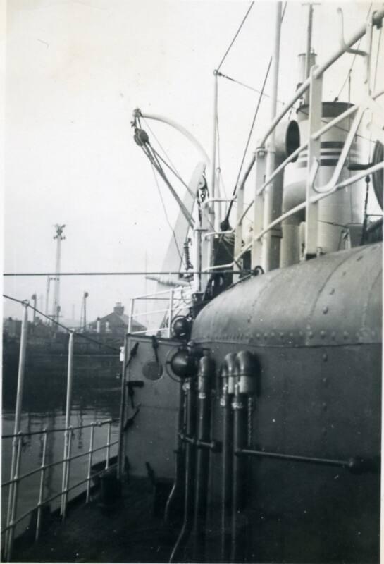 Black and White Photograph in album onboard ship- close up of railings and pipes