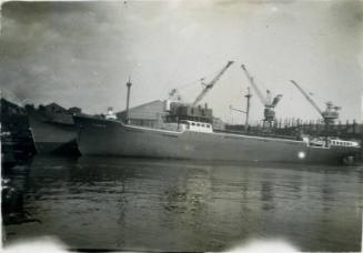 Black and White Photograph in album of 'Fulham X' and 'Enugu' alongside at Hall Russell's shipyard