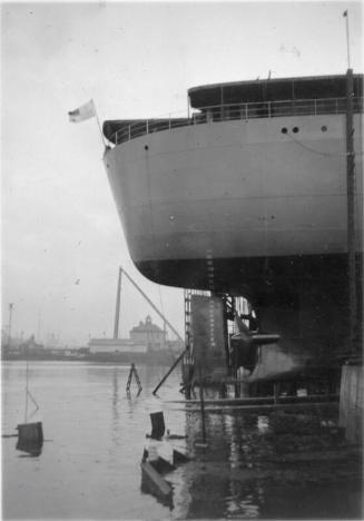 Black and White Photograph in album stern of 'Vikdal' in Hall Russell's shipyard