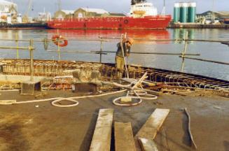 Colour Photograph Showing New Quay Being Constructed At Point Law.Osv 'northern Commander' In Backgroun