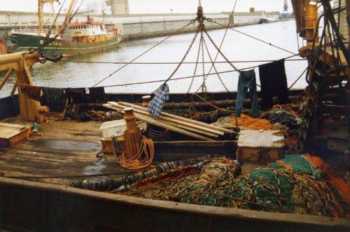 Colour Photograph Showing The Deck Of An Unidentified Fishing Vessel In Harbour, Clothes Hanging To Dry