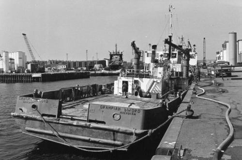 Black/White Photo Showing The Standby Vessel GRAMPIAN SWORD From Astern, In Harbour