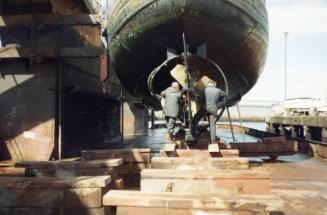 Colour Photograph Showing Two Men Working On The Propeller Of 'gleanaway'which Went Ashore, Girdleness