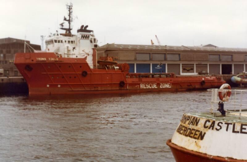 Colour Photograph Showing The Supply Vessel 'Troms Toeld', With Stern Of 'Grampian Castle' In Foreground