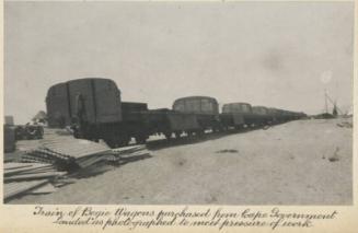 Train of Bogie Wagons purchased from Cape Government. Landed as photographed to meet pressure of work.