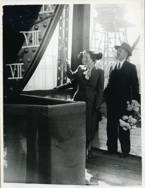 Black and white photograph showing smashing the bottle at launch of 'nordpol'