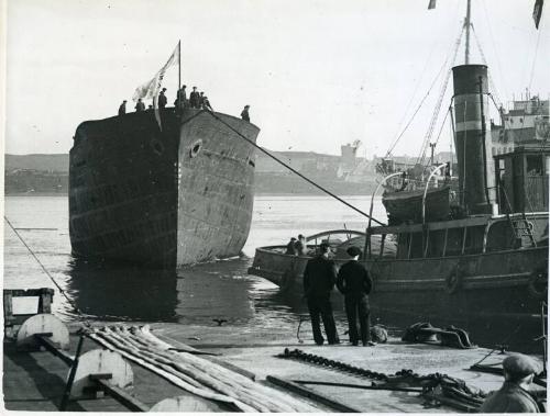 Black and white photograph showing 'fulham x' in harbour after launch